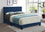 Lit en velours bleu avec tête de clou et détails en strass Comprend un support de matelas